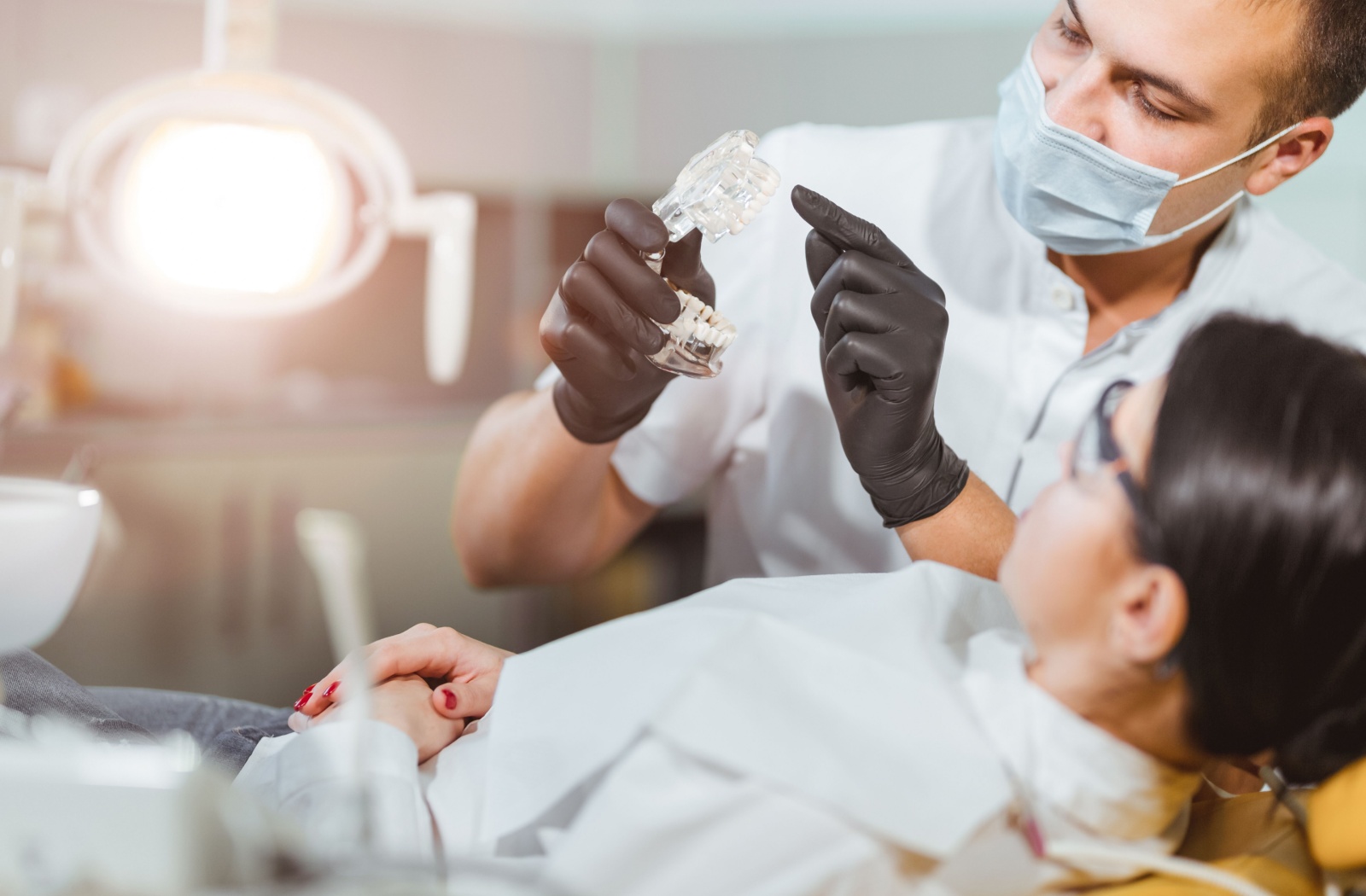 A dentist explains the details regarding the drill-free dental procedure.